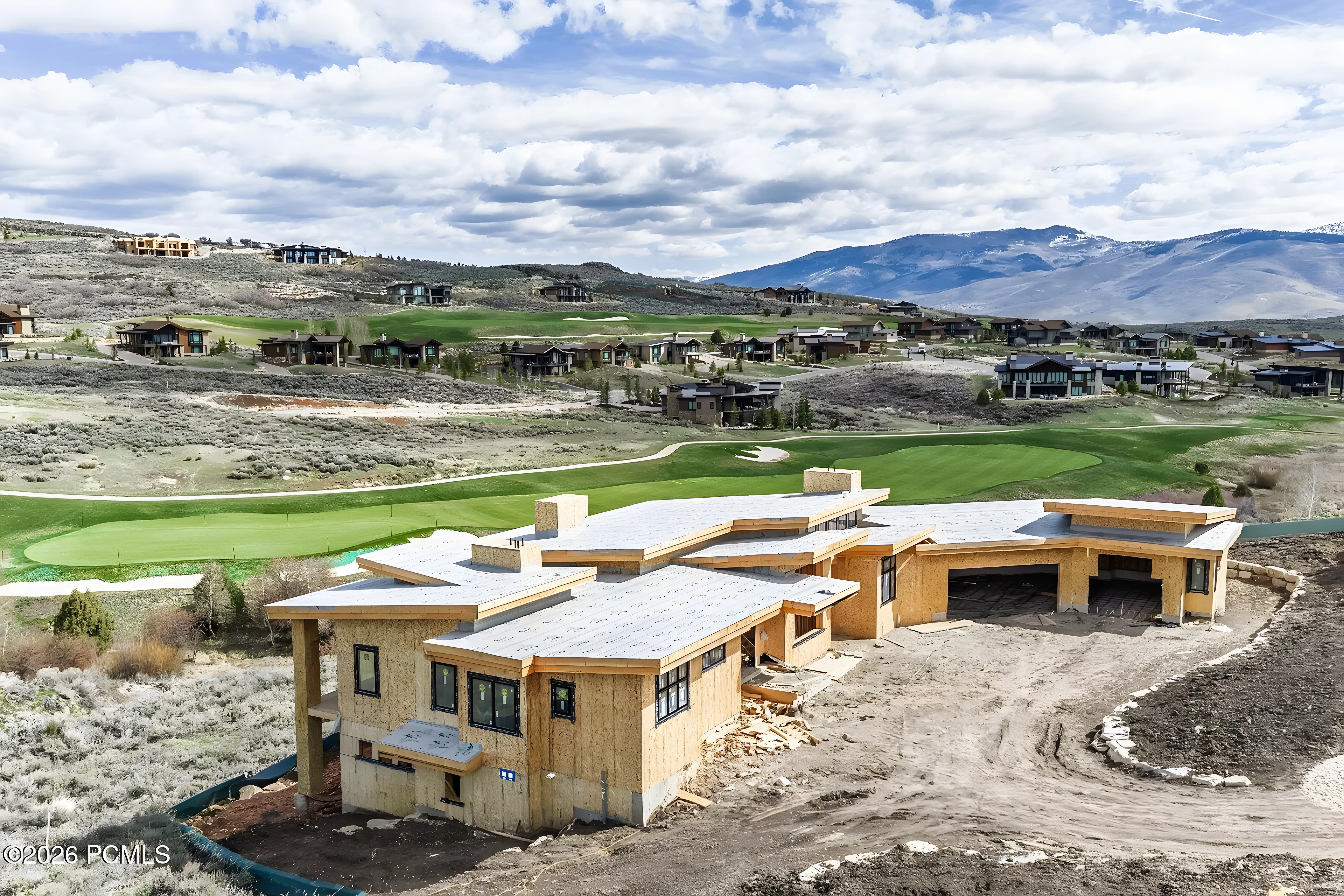 Tuhaye Golf Retreat aerial during construction with fairway behind