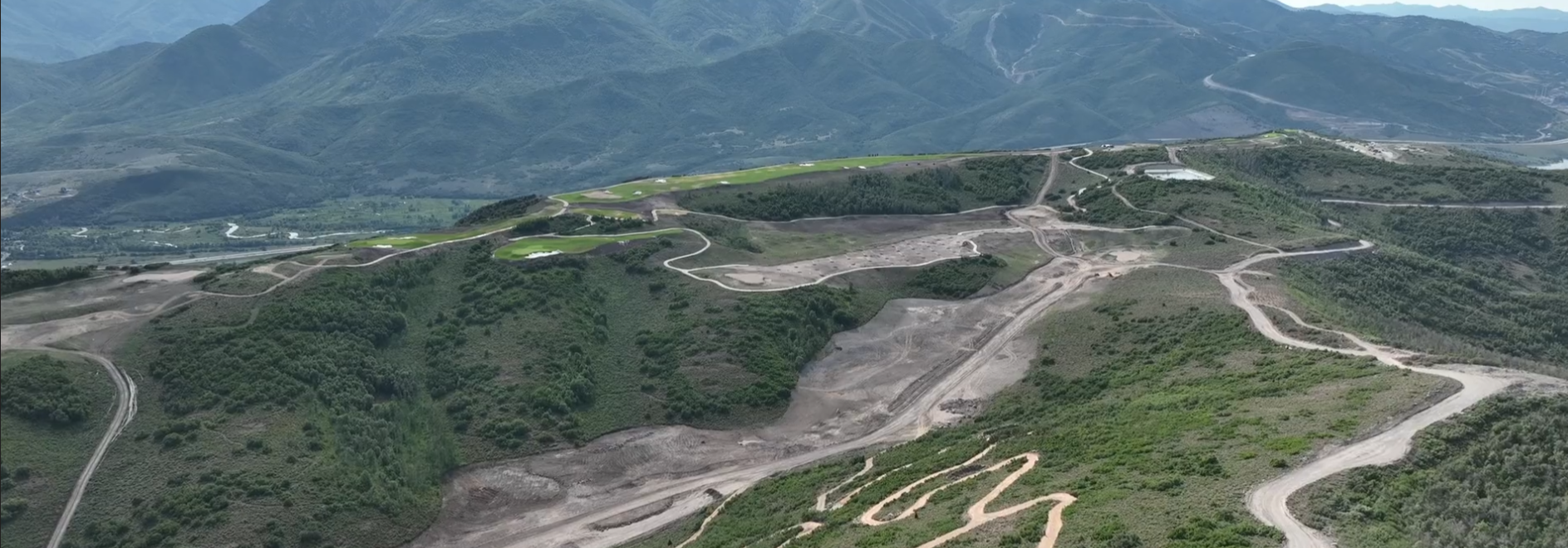 Aerial view of the Marcella at Jordanelle Ridge development corridor and surrounding Wasatch mountains