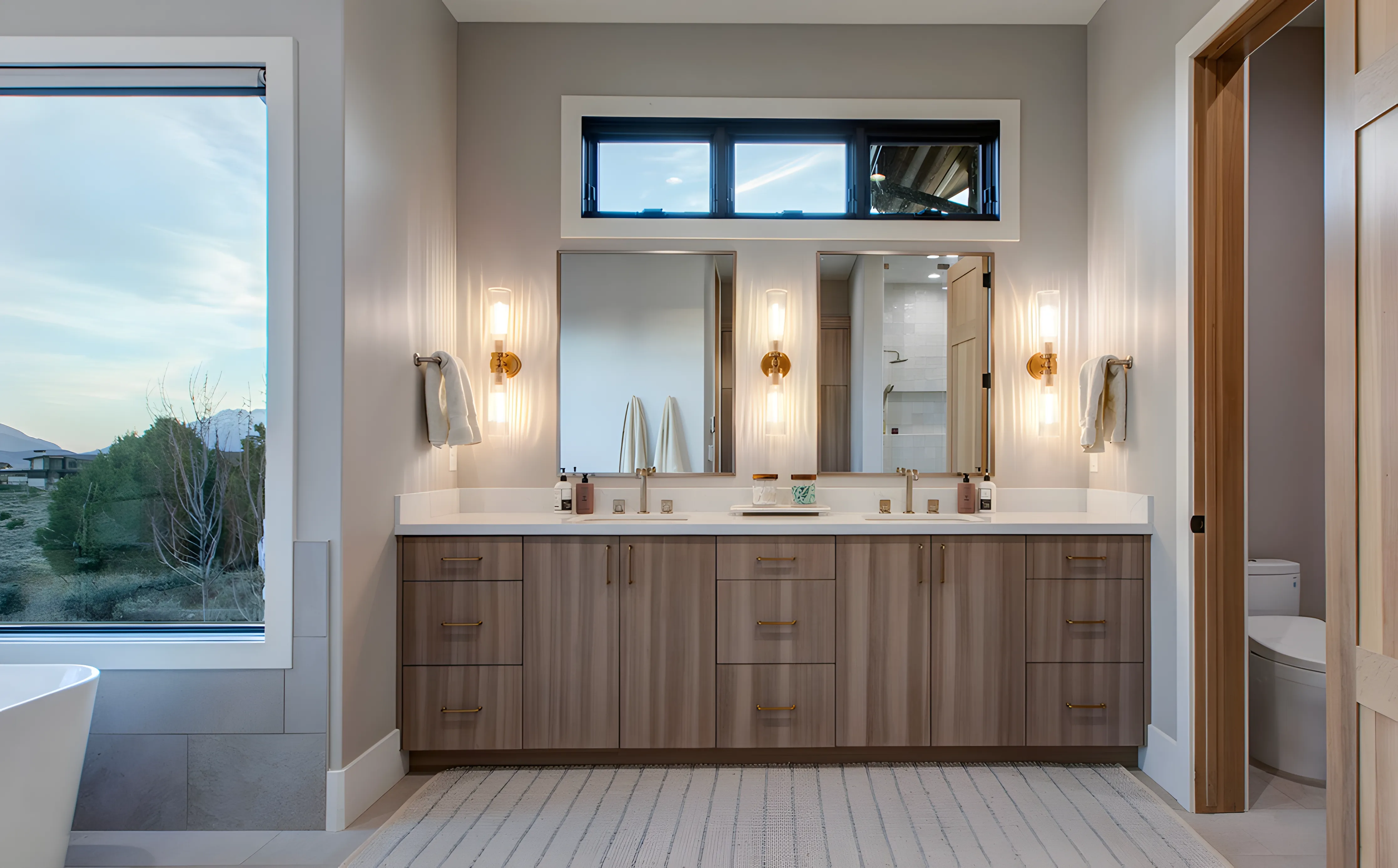 Mountain Modern Estate master bathroom with dual vanity and soaking tub