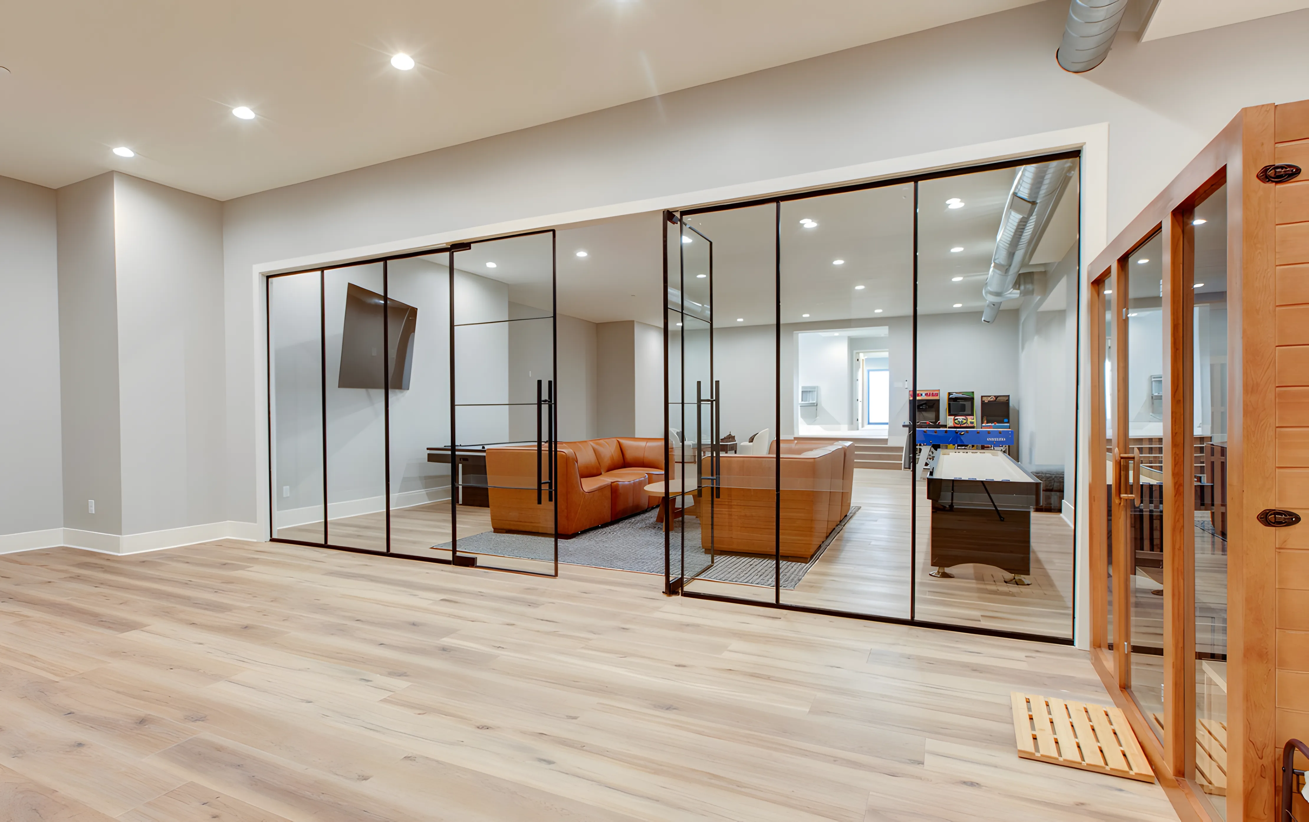 Mountain Modern Estate glass-walled wellness and game room